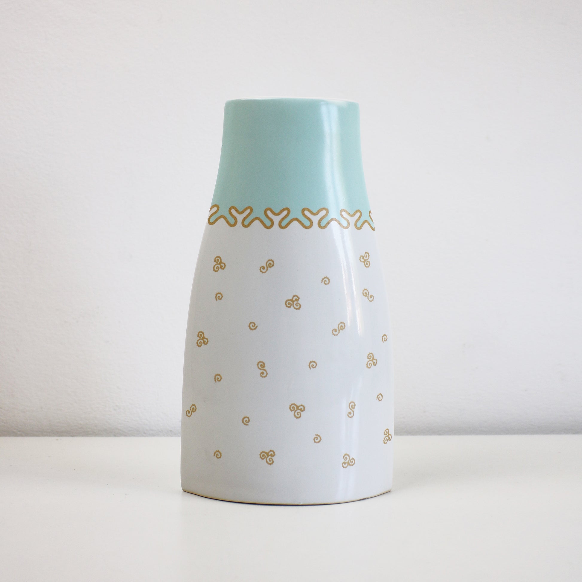 Ellipse shaped Zandra Rhodes vase for Royal Albert. My favourite things design with gold scrolls and blue border