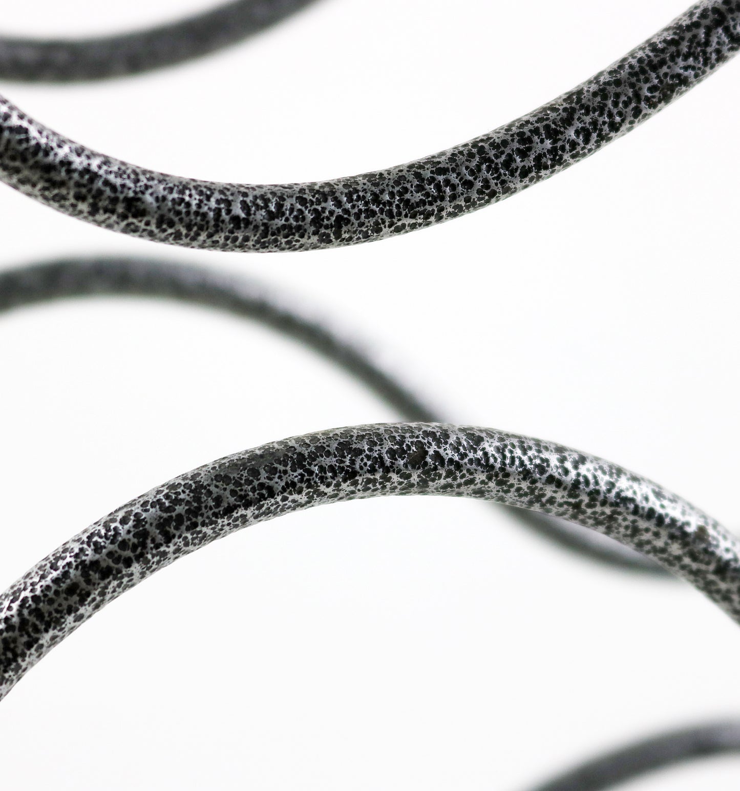 Grey and black scroll design iron wine rack