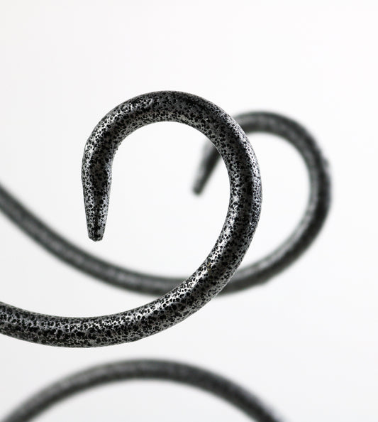 Grey and black scroll design iron wine rack