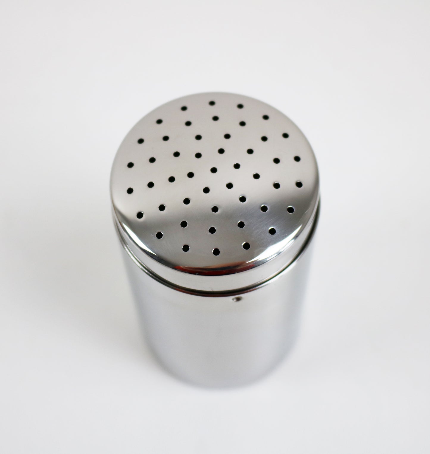 Small sugar / cocoa shaker by Carlo Alessi 1952 design. Retired re-issue unused