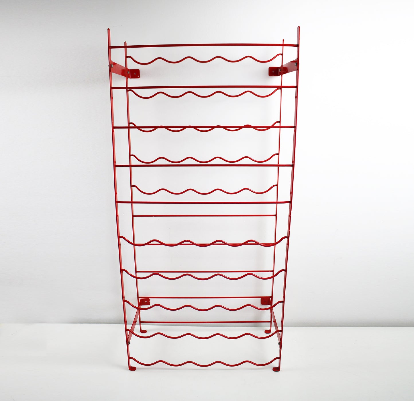Original 1980s red metal wire wine rack by Herby for Habitat