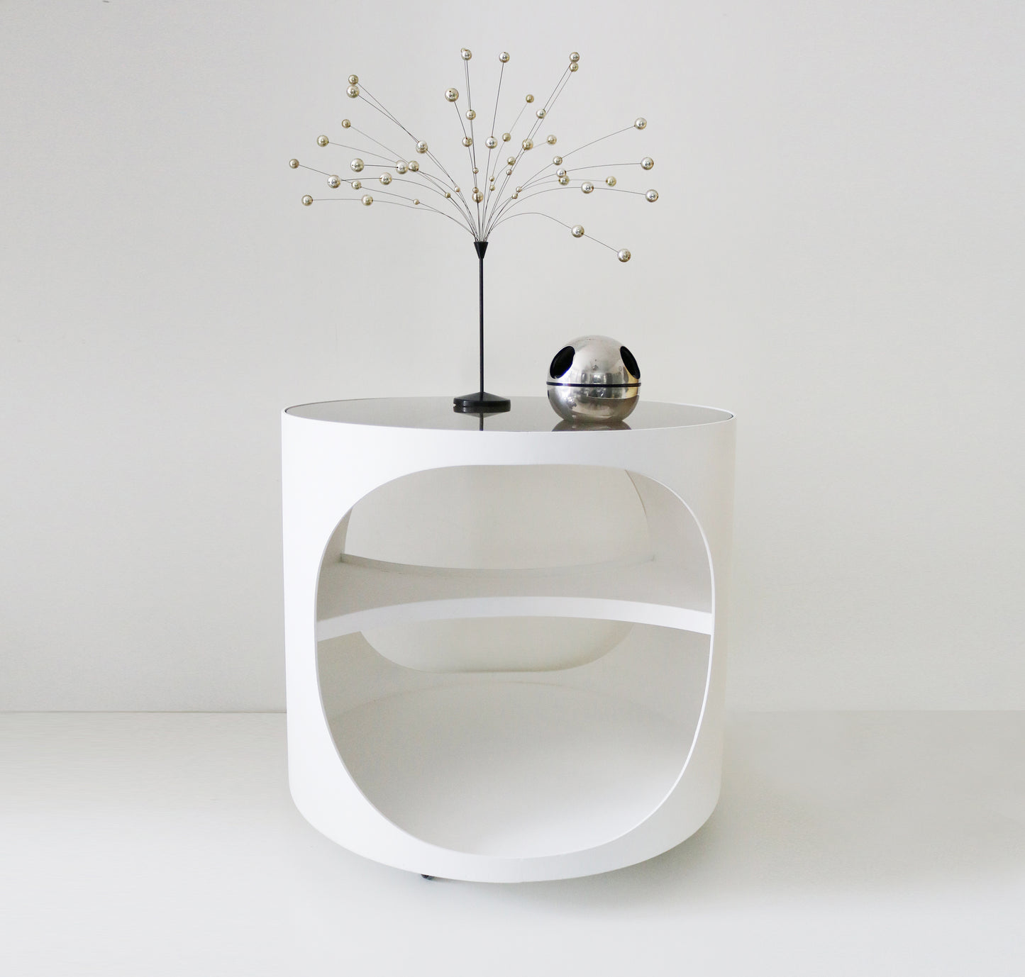Rare 1970s space age white painted ply and smoked glass trolley with cut outs and shelf - Holland / Germany