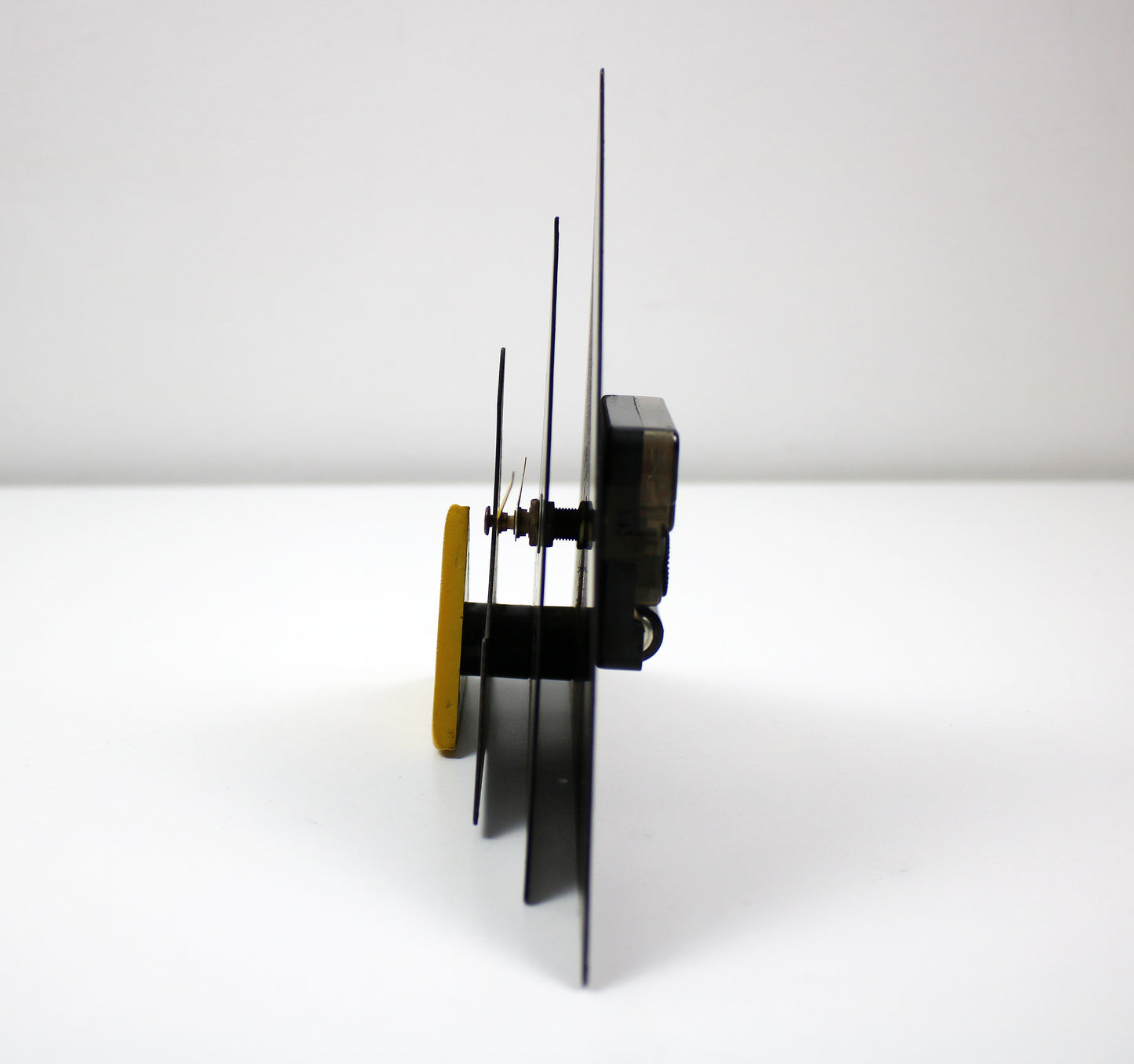 Post modern geometric mantle clock - black and yellow enamelled metal