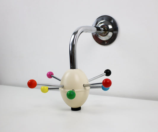 Retro Saturnus coat hanger from Present Time with bright coloured bobbles