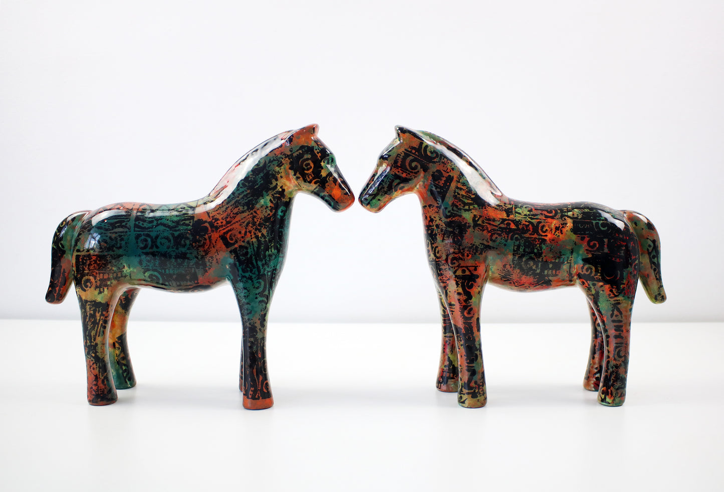 Aztec pattern glazed ceramic horses - hand decorated and signed JM Mayco 2006