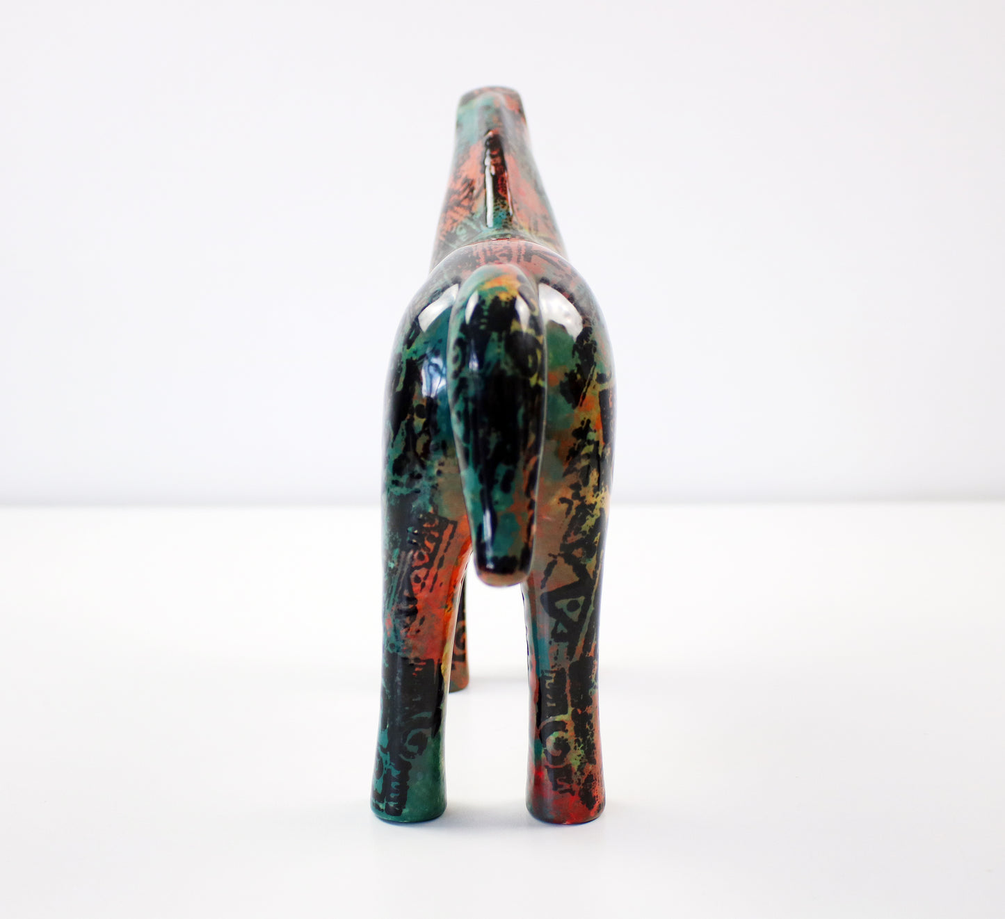 Aztec pattern glazed ceramic horses - hand decorated and signed JM Mayco 2006