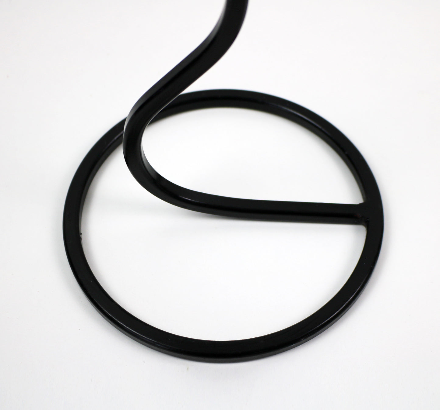 Pair of post modern floor standing wave squiggle iron candlesticks