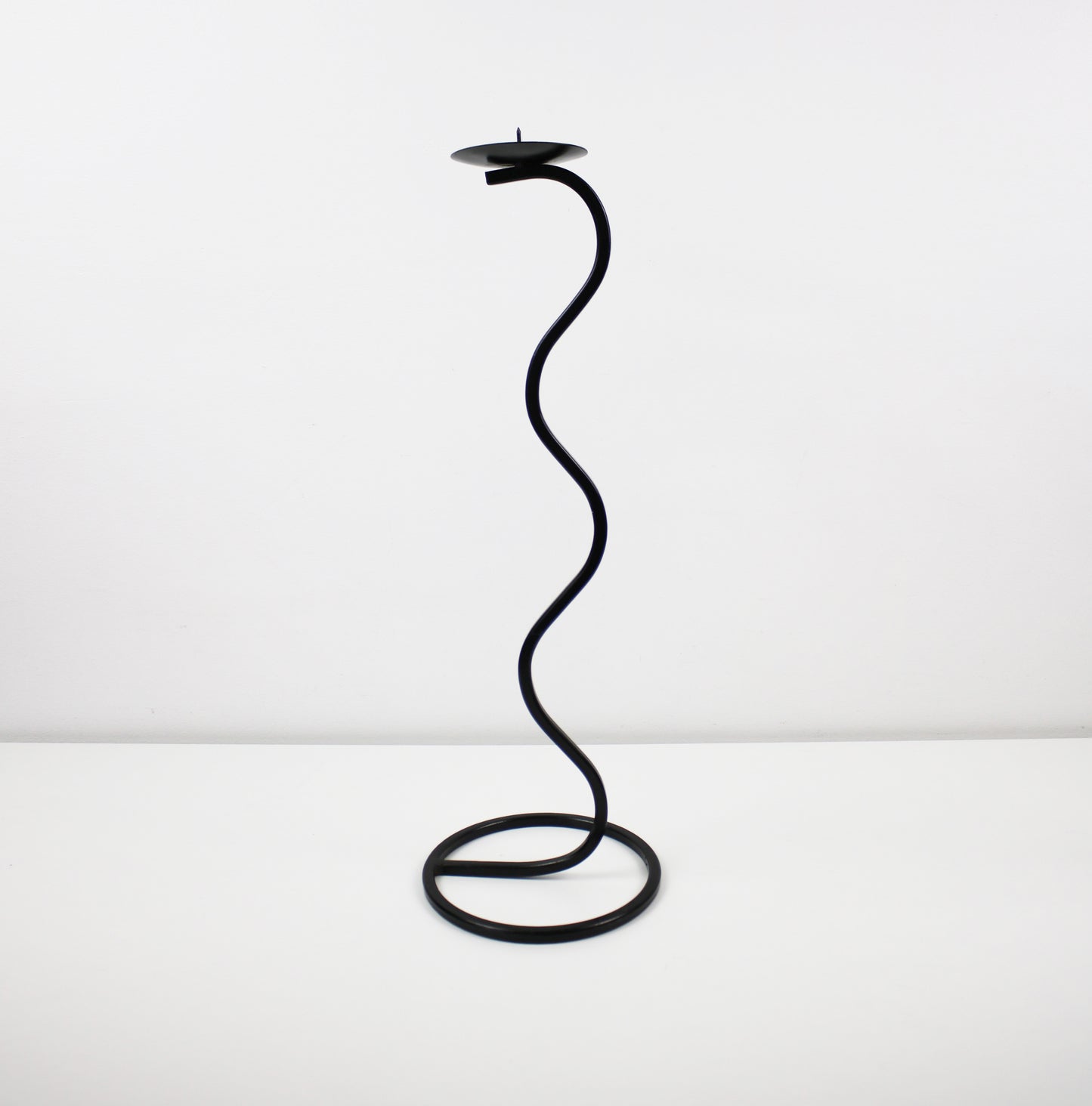 Pair of post modern floor standing wave squiggle iron candlesticks