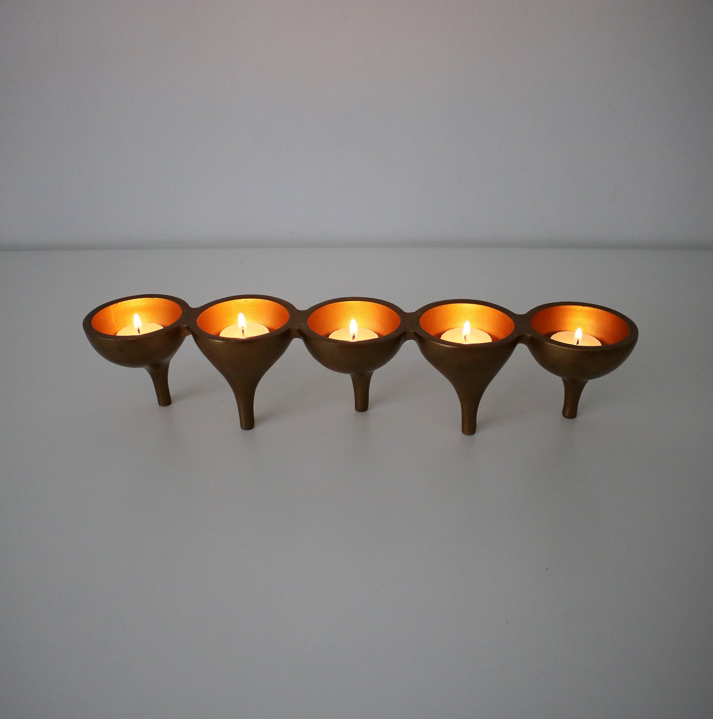 Contemporary preloved tealight candle holder - gold metal