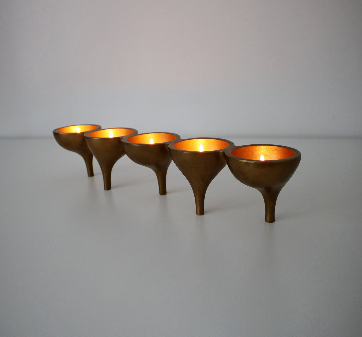 Contemporary preloved tealight candle holder - gold metal