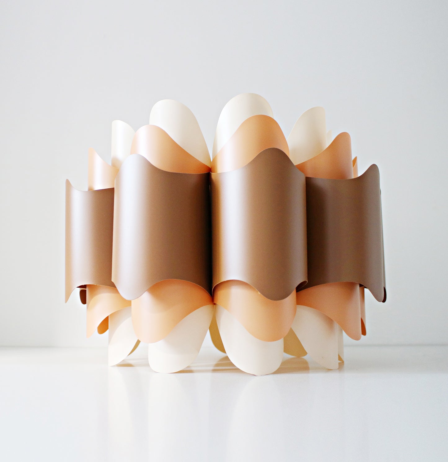 Rare 1970s ceiling lamp shade in (Hoyrup) tones of orange, brown and cream. Geometric modernist design in plastic