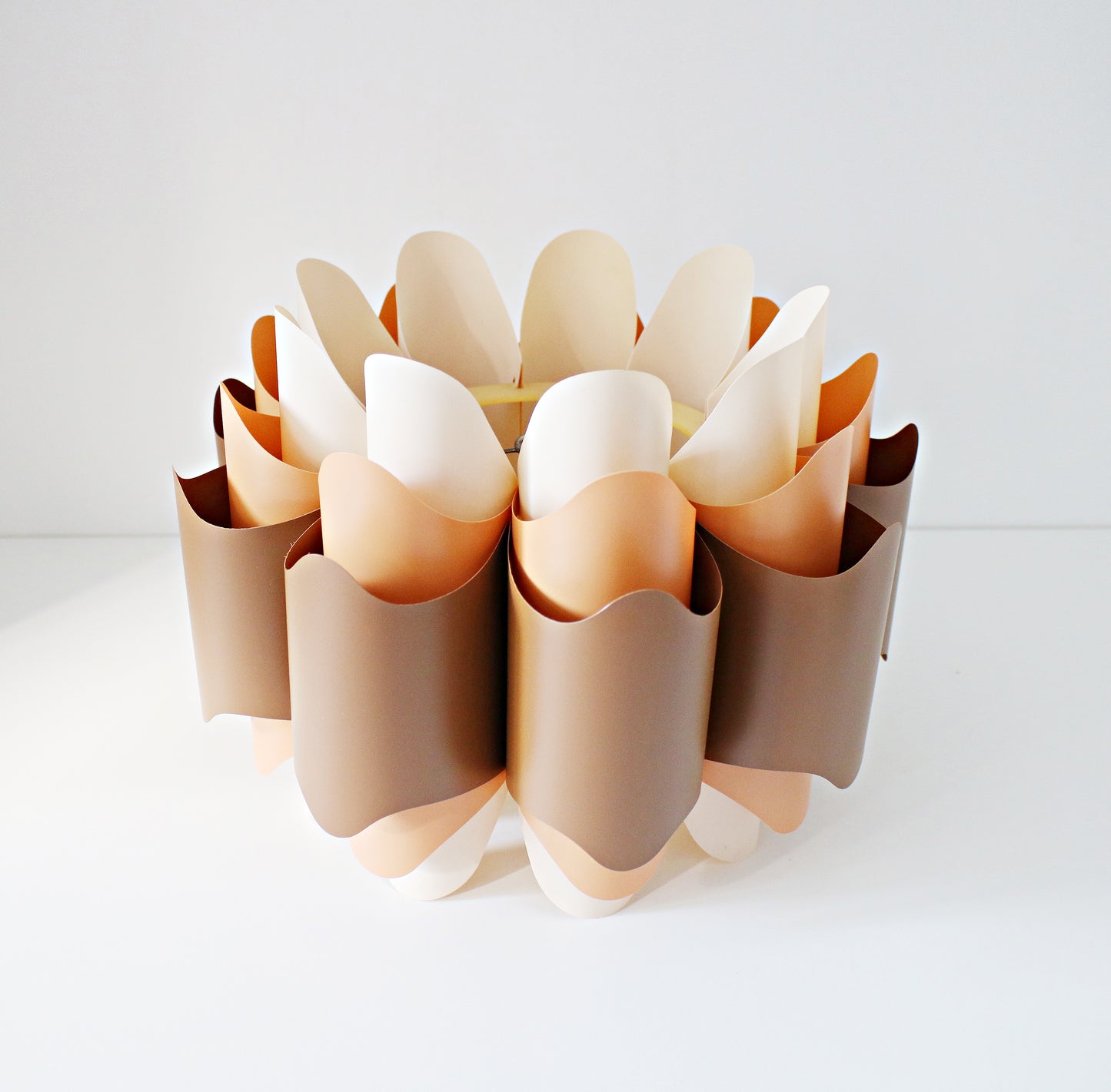 Rare 1970s ceiling lamp shade in (Hoyrup) tones of orange, brown and cream. Geometric modernist design in plastic