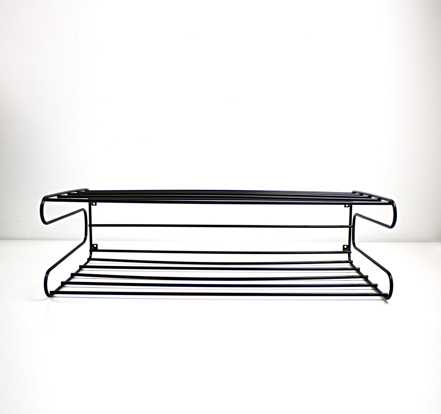 Black metal shelf on a white background