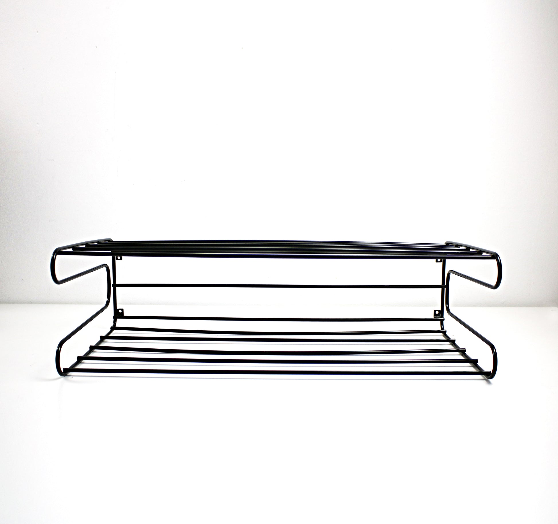 Black metal shelf on a white background
