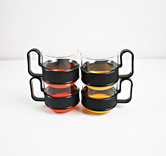Pairs of modernist Pyrex Brasilia - glass and plastic cups - black and orange or black and yellow