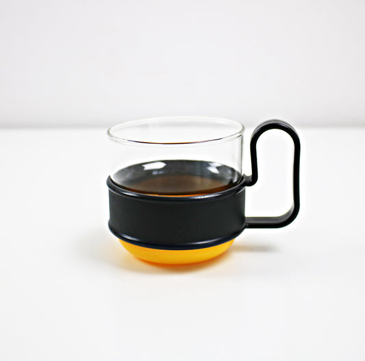Pairs of modernist Pyrex Brasilia - glass and plastic cups - black and orange or black and yellow