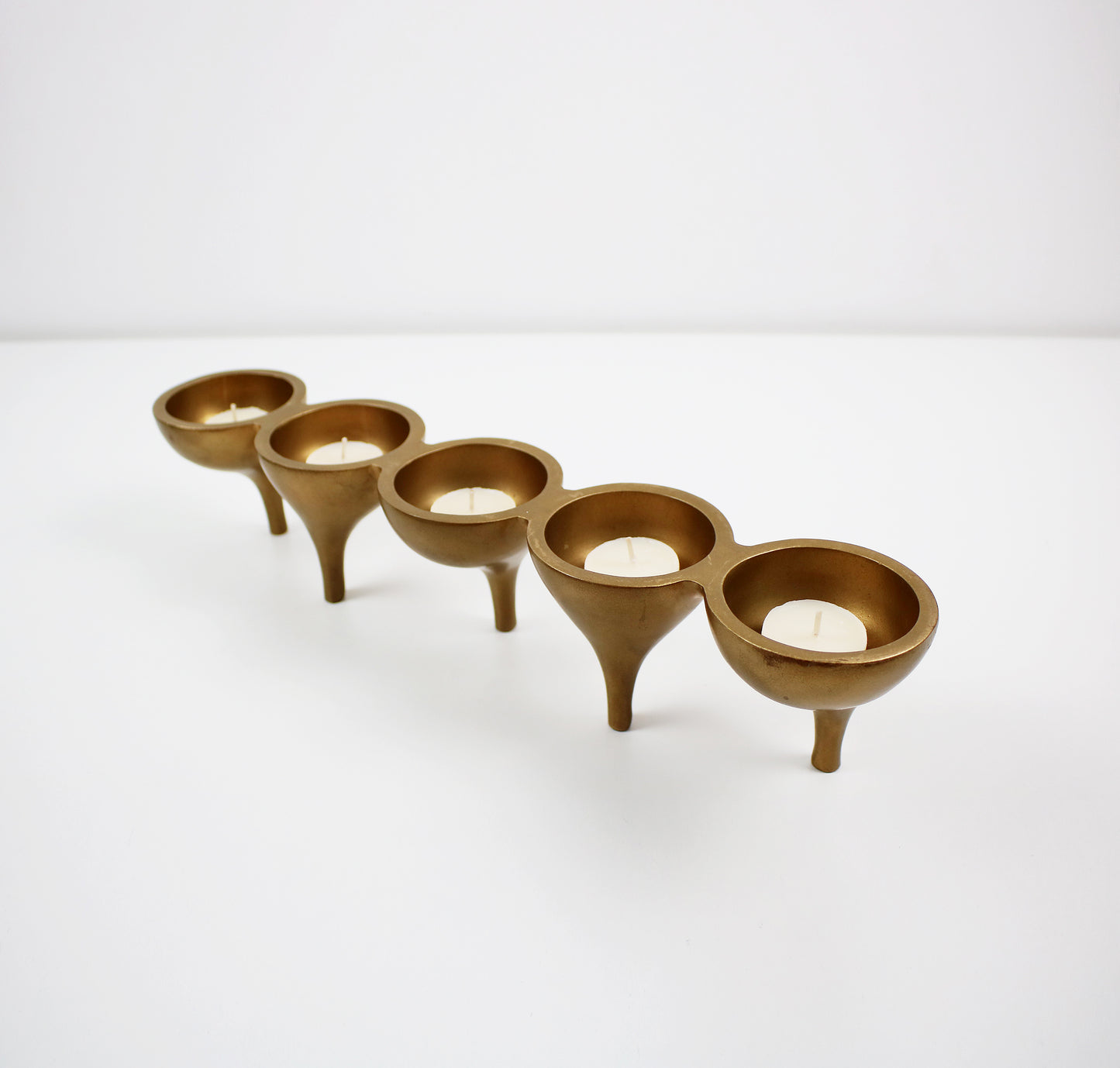 Contemporary preloved tealight candle holder - gold metal