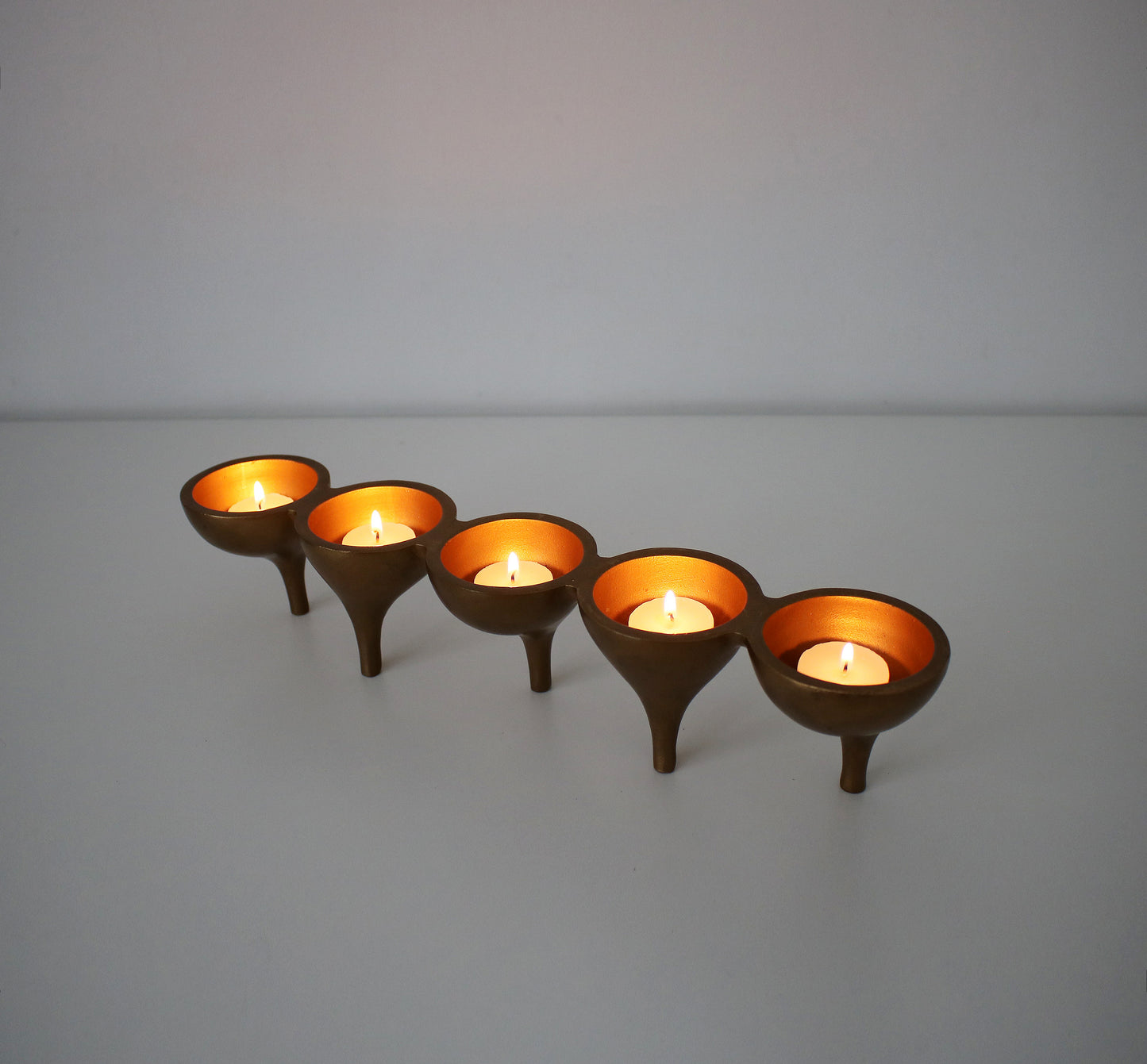 Contemporary preloved tealight candle holder - gold metal